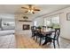 Cozy dining area features fireplace and sliding glass doors to the outdoor space at 3559 Meadow Ln, Brighton, CO 80603