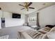 Spacious living room with neutral carpet, large window, and comfortable seating at 3559 Meadow Ln, Brighton, CO 80603