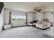 Bright living room featuring neutral tones, a large window, and a comfortable sectional sofa at 3559 Meadow Ln, Brighton, CO 80603
