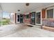 Features a covered patio with brick accents and double doors, blending indoor-outdoor living for entertaining at 3559 Meadow Ln, Brighton, CO 80603