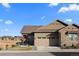 Two-story house exterior with a two-car garage, and a landscaped front yard at 4361 Hidden Gulch Rd, Castle Rock, CO 80104