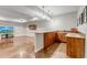 Finished basement bar area with stylish countertops, sink, cabinets, and pendant lighting at 15902 W 64Th Ave, Arvada, CO 80007