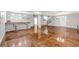 Large finished basement with bar area, tile floor and neutral decor at 15902 W 64Th Ave, Arvada, CO 80007