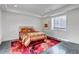 Bright bedroom features neutral walls, recessed lighting, large window, and sleek flooring at 15902 W 64Th Ave, Arvada, CO 80007