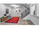 Inviting entryway with modern staircase, stylish console table, and elegant decor at 15902 W 64Th Ave, Arvada, CO 80007