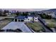 Luxury home showcasing manicured landscaping, a spacious driveway, and a three-car garage at 15902 W 64Th Ave, Arvada, CO 80007