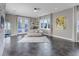 Bright living room featuring large windows with views, tiled floors, and neutral decor at 15902 W 64Th Ave, Arvada, CO 80007