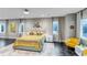 Bright main bedroom with mountain views, modern lighting, and neutral decor at 15902 W 64Th Ave, Arvada, CO 80007