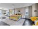 Spacious main bedroom with natural light, neutral decor, and mountain views at 15902 W 64Th Ave, Arvada, CO 80007