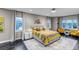 Spacious main bedroom with natural light, neutral decor, and mountain views at 15902 W 64Th Ave, Arvada, CO 80007