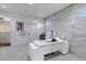 Bright office space with large modern desk, accent wall, and neutral decor at 15902 W 64Th Ave, Arvada, CO 80007