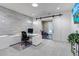 Bright office featuring modern desk, barn door, and access to a home gym at 15902 W 64Th Ave, Arvada, CO 80007
