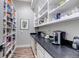 Spacious pantry featuring ample shelving, countertop space, and modern appliances at 15902 W 64Th Ave, Arvada, CO 80007