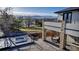 Inviting outdoor patio with a fireplace, dining area, and hot tub, perfect for relaxing and entertaining at 15902 W 64Th Ave, Arvada, CO 80007