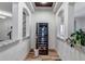 Wine cellar with temperature-controlled storage and stone accents at 15902 W 64Th Ave, Arvada, CO 80007