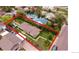 An aerial view of a single-story home showcasing its compact layout and a yard enclosed by a tall hedge at 2258 S Galapago St, Denver, CO 80223