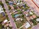 An aerial view captures a quiet residential neighborhood with tree-lined streets and a mix of home styles, showcasing community charm at 2258 S Galapago St, Denver, CO 80223