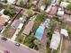 A detailed aerial shot captures a residential area with various home styles, mature trees, and well-maintained yards, highlighting neighborhood appeal at 2258 S Galapago St, Denver, CO 80223
