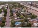 Aerial view showcases a charming neighborhood near green spaces, highways, and the Denver city skyline in the background at 2258 S Galapago St, Denver, CO 80223
