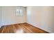 Bright bedroom featuring wood floors and a single window at 2258 S Galapago St, Denver, CO 80223