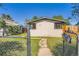 Charming single-story home with a small front yard and gated entry on a sunny day at 2258 S Galapago St, Denver, CO 80223
