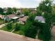 View of a charming neighborhood homes surrounded by lush greenery and mature trees at 2258 S Galapago St, Denver, CO 80223