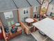 Aerial view showcases townhomes with patios, carport, gardens, and outdoor dining areas at 1150 Inca St # 39, Denver, CO 80204