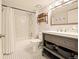 Updated bathroom with subway tile shower and modern vanity at 1150 Inca St # 39, Denver, CO 80204
