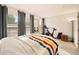 Bright bedroom with large windows and exercise equipment at 1150 Inca St # 39, Denver, CO 80204