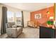 Comfortable Bedroom features a gray armchair, natural light, and decor accents at 1150 Inca St # 39, Denver, CO 80204
