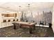 Recreation room features a pool table, bar seating and a decorative forest mural wall at 1150 Inca St # 39, Denver, CO 80204