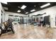 A gym with mirrors, free weights, exercise equipment, and wood floors at 1150 Inca St # 39, Denver, CO 80204
