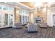 The spacious lobby features a fireplace, comfortable seating, and ample natural light from large windows at 1150 Inca St # 39, Denver, CO 80204