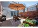 Enjoy outdoor dining on the private patio with a grill, dining set, and garden at 1150 Inca St # 39, Denver, CO 80204