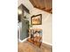 Charming staircase featuring wood and black iron accents and a rustic wine rack at 1150 Inca St # 39, Denver, CO 80204