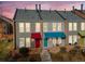 Row of townhomes featuring colorful awnings and well-maintained exteriors, creating a vibrant residential scene at 1150 Inca St # 39, Denver, CO 80204