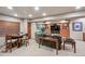 Basement features a home theater area and an adjacent seating area with a bar for casual gathering at 14417 W 57Th Pl, Arvada, CO 80002