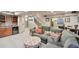 Open basement with an entertainment area, mini-bar, and comfortable seating, perfect for relaxation and recreation at 14417 W 57Th Pl, Arvada, CO 80002