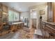 Spacious bathroom with luxurious soaking tub, tiled shower, and dual vanity with granite counters at 14417 W 57Th Pl, Arvada, CO 80002