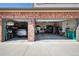Spacious three car garage featuring ample storage, workshop space, and bright lighting at 14417 W 57Th Pl, Arvada, CO 80002