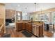Well-equipped kitchen featuring granite countertops, stainless steel appliances, and a breakfast nook at 14417 W 57Th Pl, Arvada, CO 80002