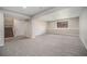 Finished basement offers a large, versatile living space with neutral paint at 17548 E Wesley Pl, Aurora, CO 80013