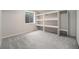 Basement bedroom/flex area with built-in storage and natural light from the window at 17548 E Wesley Pl, Aurora, CO 80013