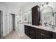 Spa-like bathroom features double vanity, mirrors, modern cabinetry, and walk-in shower at 17548 E Wesley Pl, Aurora, CO 80013