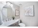 Bathroom features modern vanity, updated faucet and fixtures, and contemporary floral artwork at 17548 E Wesley Pl, Aurora, CO 80013