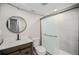 Updated bathroom featuring a sleek vanity and modern shower with glass doors at 17548 E Wesley Pl, Aurora, CO 80013