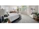 Bright bedroom offers large windows, plush carpeting, and comfortable furnishings at 17548 E Wesley Pl, Aurora, CO 80013