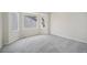 Empty bedroom boasts plush neutral carpeting, a bay window, and large base molding at 17548 E Wesley Pl, Aurora, CO 80013