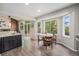 Bright breakfast nook features hardwood floors, recessed lighting, and large windows offering backyard views at 17548 E Wesley Pl, Aurora, CO 80013