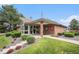 Clubhouse with brick facade, glass entryway and manicured landscaping at 17548 E Wesley Pl, Aurora, CO 80013